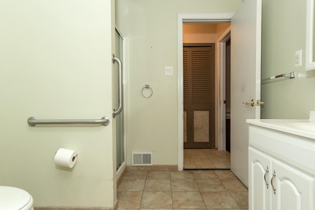 18210 Rainbow Dr, Lathrup Village, MI 48076 - full bathroom with vanity, an enclosed shower, tile patterned floors, and a closet