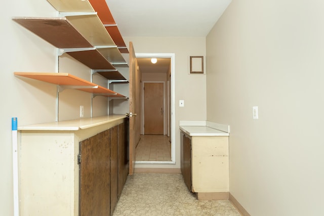 18210 Rainbow Dr, Lathrup Village, MI 48076 - corridor featuring baseboards and light floors