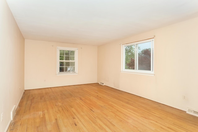 18210 Rainbow Dr, Lathrup Village, MI 48076 - unfurnished room with light wood-style flooring and healthy amount of natural light