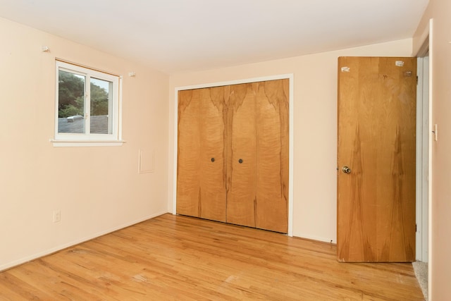 18210 Rainbow Dr, Lathrup Village, MI 48076 - unfurnished bedroom with wood finished floors and a closet