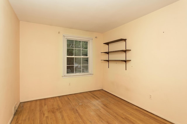 18210 Rainbow Dr, Lathrup Village, MI 48076 - spare room featuring light wood-style floors and baseboards