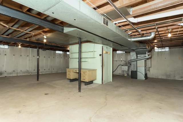 18210 Rainbow Dr, Lathrup Village, MI 48076 - unfinished basement with heating unit and a sink