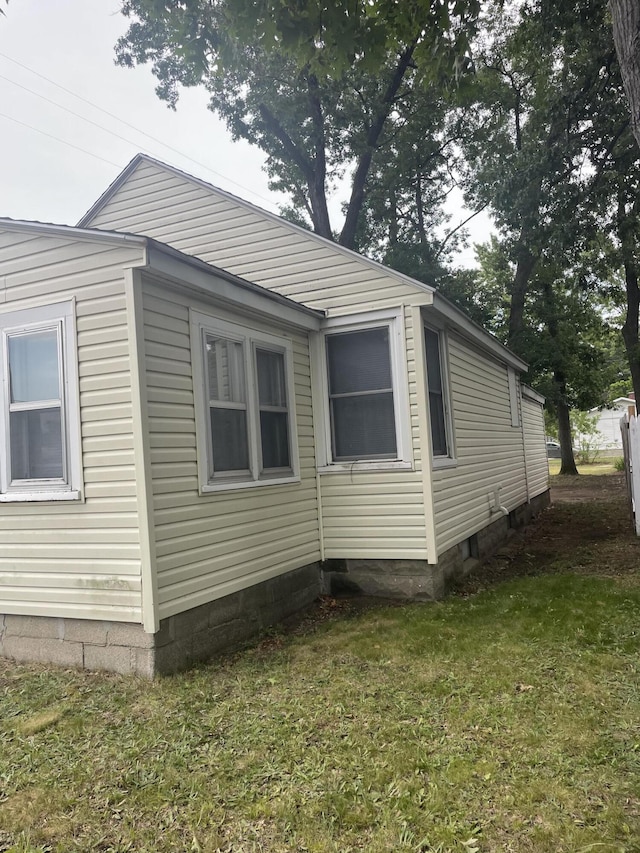 1111 S Quarterline Rd, Muskegon, MI 49442 - view of property exterior with a lawn