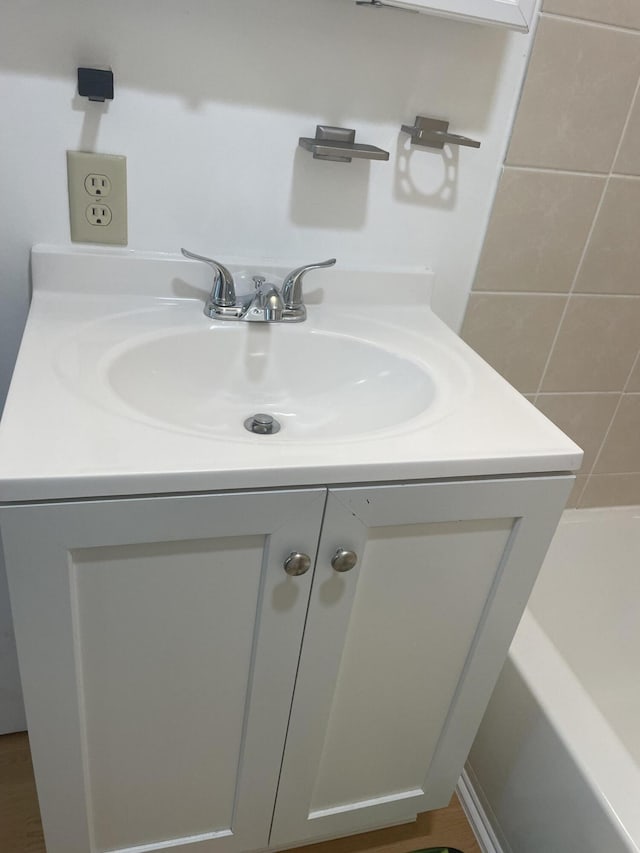 1111 S Quarterline Rd, Muskegon, MI 49442 - bathroom with vanity and a bathtub
