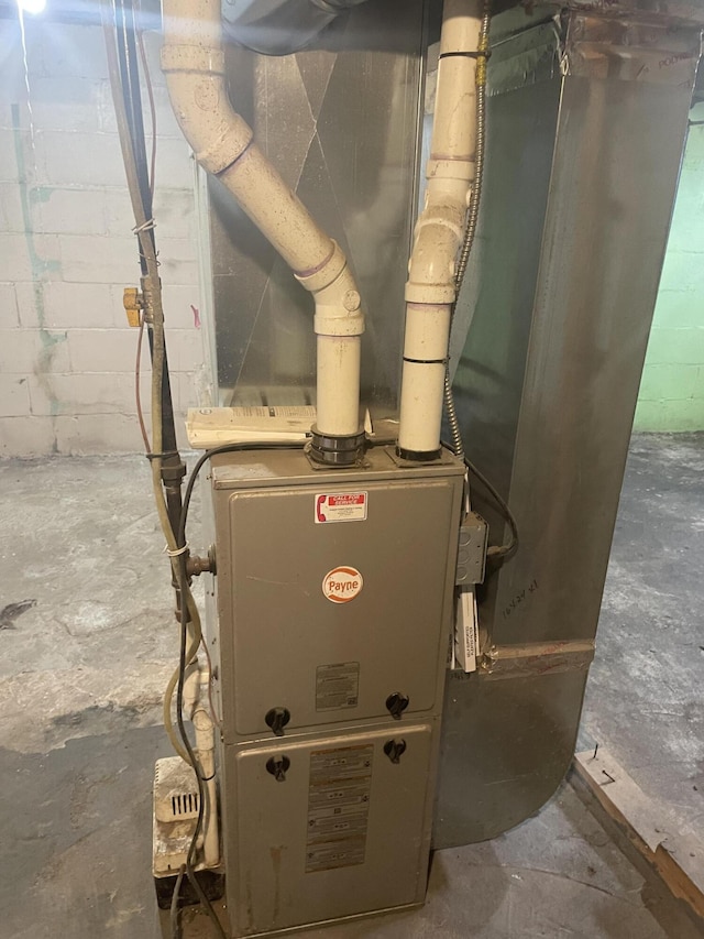 1111 S Quarterline Rd, Muskegon, MI 49442 - utility room with heating unit