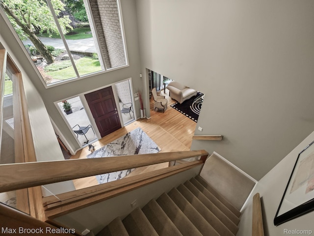 6224 Bromley Ct, West Bloomfield, MI 48322 - staircase featuring wood finished floors and plenty of natural light