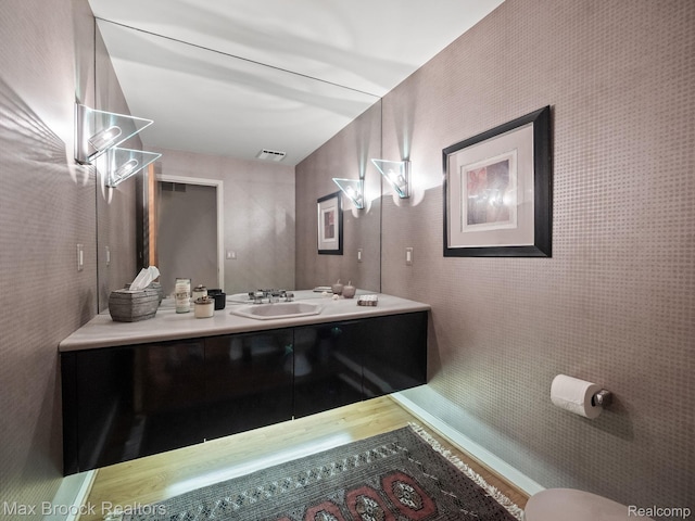 6224 Bromley Ct, West Bloomfield, MI 48322 - half bathroom featuring vanity and wood finished floors