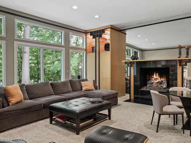 6224 Bromley Ct, West Bloomfield, MI 48322 - carpeted living area featuring a tile fireplace and recessed lighting