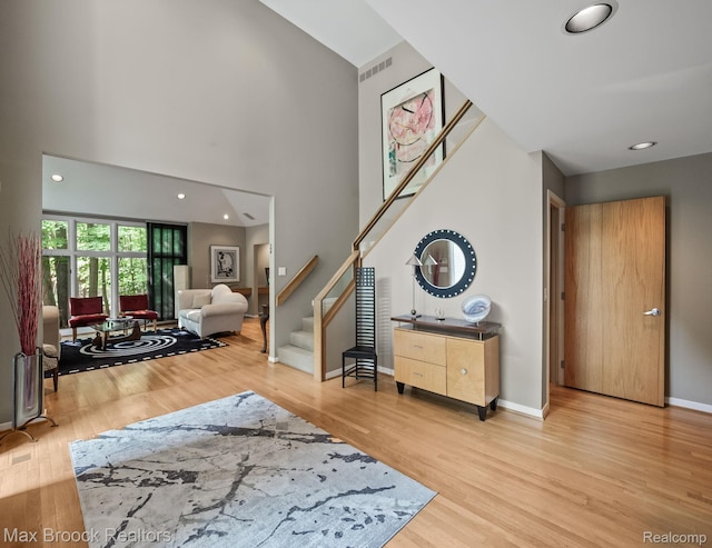 6224 Bromley Ct, West Bloomfield, MI 48322 - entryway with stairway, wood finished floors, a towering ceiling, and recessed lighting