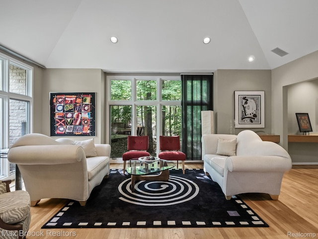 6224 Bromley Ct, West Bloomfield, MI 48322 - living room with healthy amount of natural light, wood finished floors, recessed lighting, and high vaulted ceiling