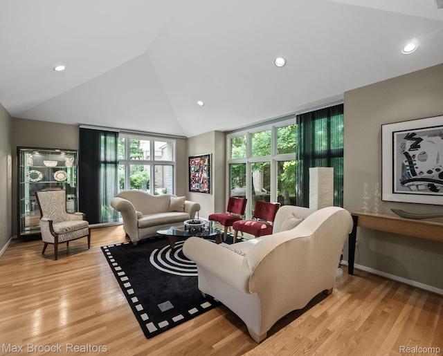6224 Bromley Ct, West Bloomfield, MI 48322 - living area featuring vaulted ceiling, light wood-style flooring, and recessed lighting