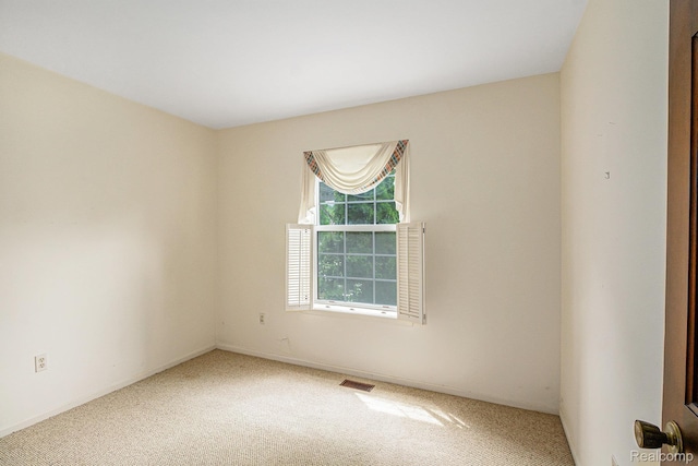 6392 Mckenzie Dr, Flint, MI 48507 - spare room with carpet floors