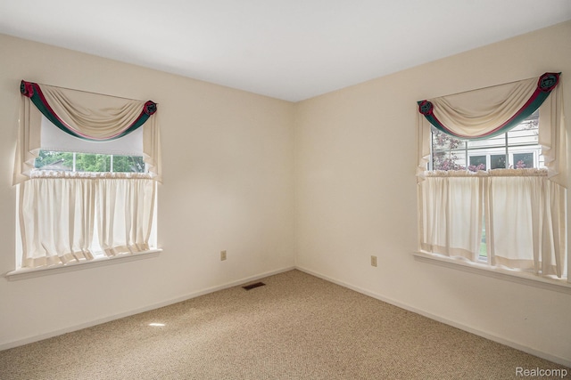6392 Mckenzie Dr, Flint, MI 48507 - carpeted spare room featuring healthy amount of natural light