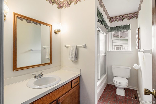 6392 Mckenzie Dr, Flint, MI 48507 - full bathroom featuring vanity, brick patterned flooring, and enclosed tub / shower combo