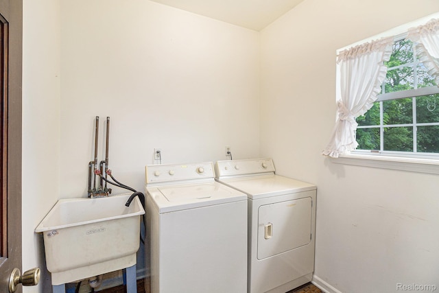 6392 Mckenzie Dr, Flint, MI 48507 - washroom featuring washing machine and dryer and baseboards