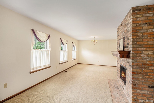 6392 Mckenzie Dr, Flint, MI 48507 - unfurnished living room featuring a brick fireplace, a chandelier, and carpet floors