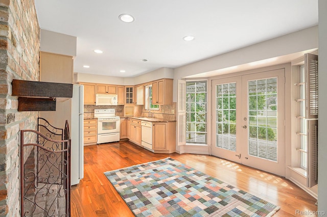 6392 Mckenzie Dr, Flint, MI 48507 - kitchen with white appliances, light brown cabinetry, light wood-style flooring, backsplash, and recessed lighting