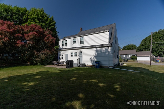 2036 Dawson Ave NE, Grand Rapids, MI 49505 - rear view of property with a chimney, a yard, a patio, and entry steps