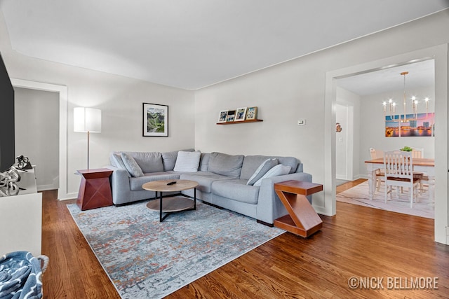 2036 Dawson Ave NE, Grand Rapids, MI 49505 - living area featuring a chandelier and wood finished floors