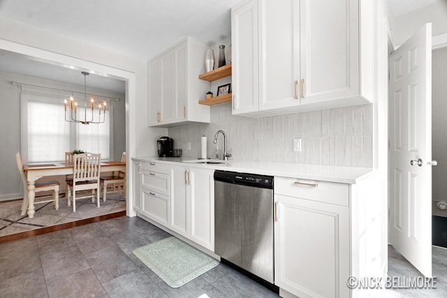 2036 Dawson Ave NE, Grand Rapids, MI 49505 - kitchen featuring stainless steel dishwasher, open shelves, light countertops, tasteful backsplash, and a chandelier