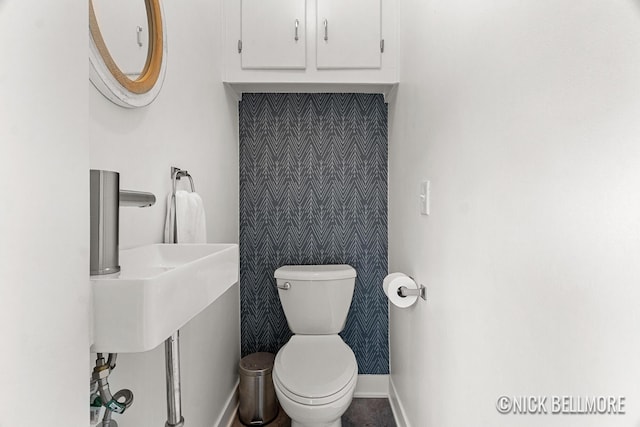 2036 Dawson Ave NE, Grand Rapids, MI 49505 - bathroom featuring baseboards and toilet