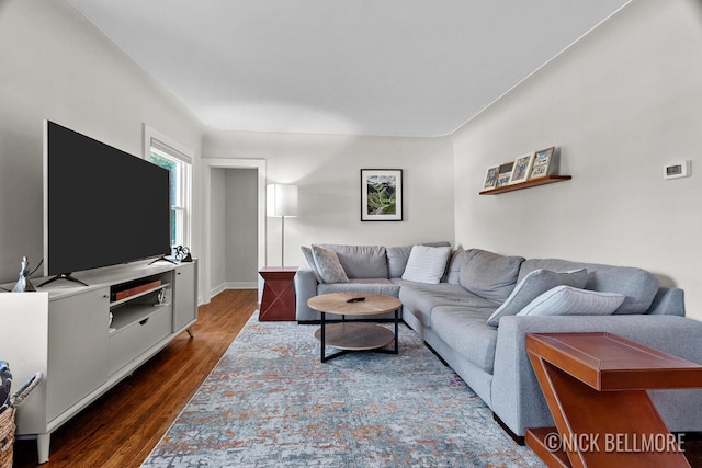 2036 Dawson Ave NE, Grand Rapids, MI 49505 - living area featuring dark wood-style flooring