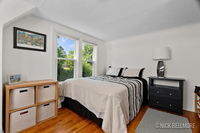 2036 Dawson Ave NE, Grand Rapids, MI 49505 - bedroom with lofted ceiling and wood finished floors