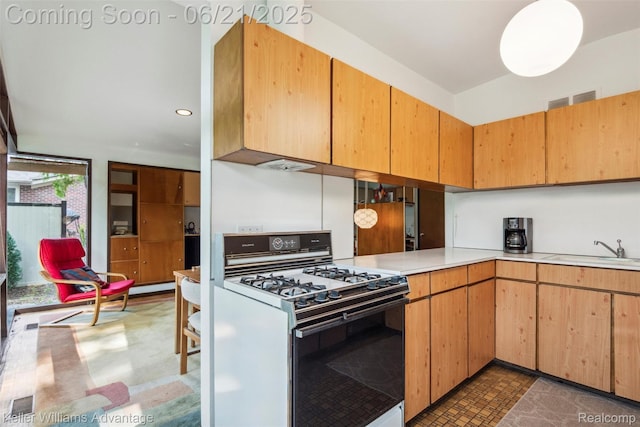 5959 Rosetta St, Dearborn Heights, MI 48127 - kitchen featuring white gas range, light countertops, and recessed lighting