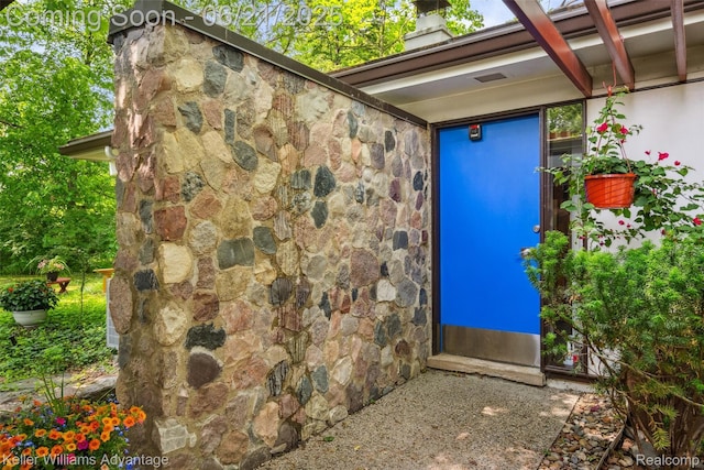 5959 Rosetta St, Dearborn Heights, MI 48127 - doorway to property featuring stone siding