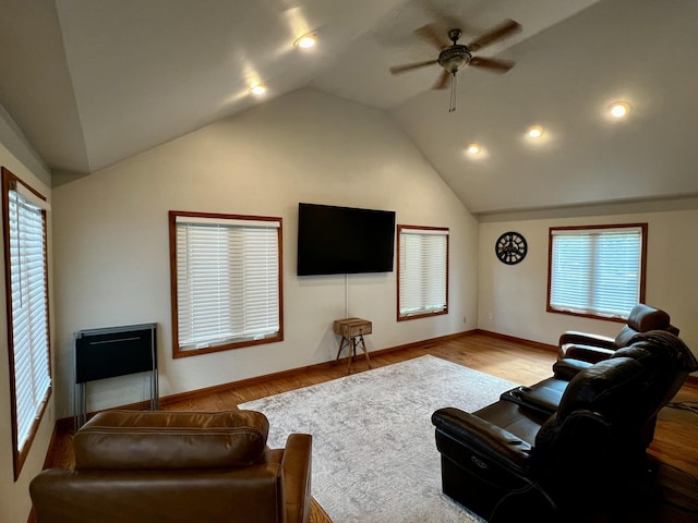 9910 8 Mile Rd, Ceresco, MI 49033 - living room with ceiling fan, vaulted ceiling, wood finished floors, healthy amount of natural light, and recessed lighting
