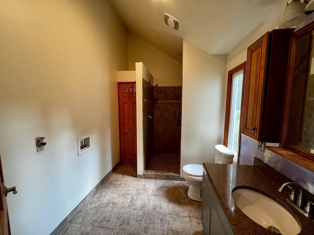 9910 8 Mile Rd, Ceresco, MI 49033 - full bathroom featuring vanity, a tile shower, and lofted ceiling