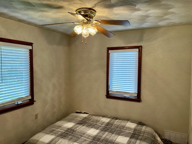 9910 8 Mile Rd, Ceresco, MI 49033 - bedroom featuring a ceiling fan
