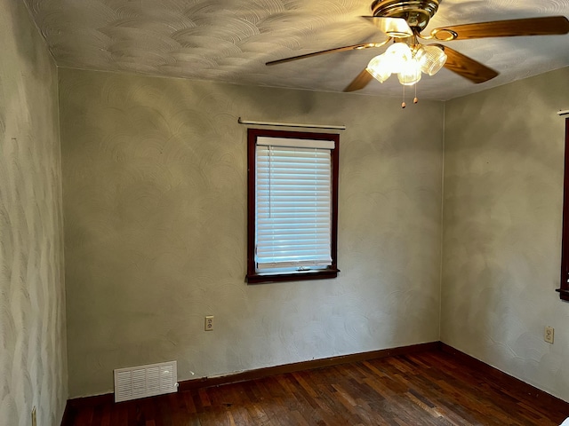 9910 8 Mile Rd, Ceresco, MI 49033 - spare room featuring dark wood-style flooring and a ceiling fan