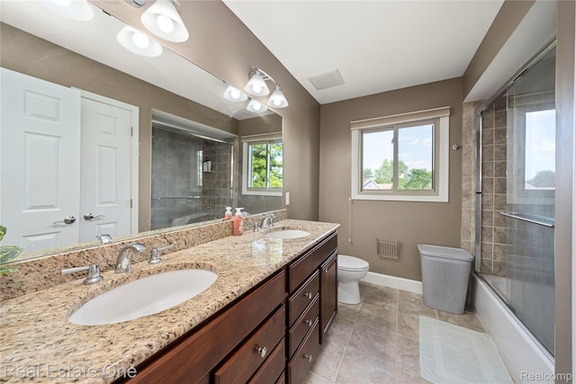 25006 Davenport Ave, Novi, MI 48374 - bathroom featuring double vanity, combined bath / shower with glass door, and tile patterned floors