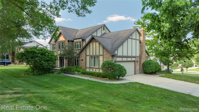 25006 Davenport Ave, Novi, MI 48374 - tudor home featuring a front lawn, concrete driveway, a garage, a shingled roof, and brick siding