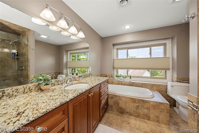 25006 Davenport Ave, Novi, MI 48374 - bathroom featuring vanity, a garden tub, a stall shower, and recessed lighting