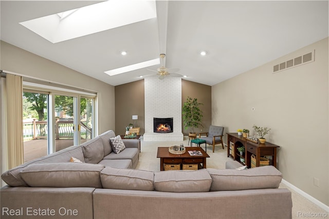 25006 Davenport Ave, Novi, MI 48374 - living room with a skylight, a fireplace, a ceiling fan, and light colored carpet