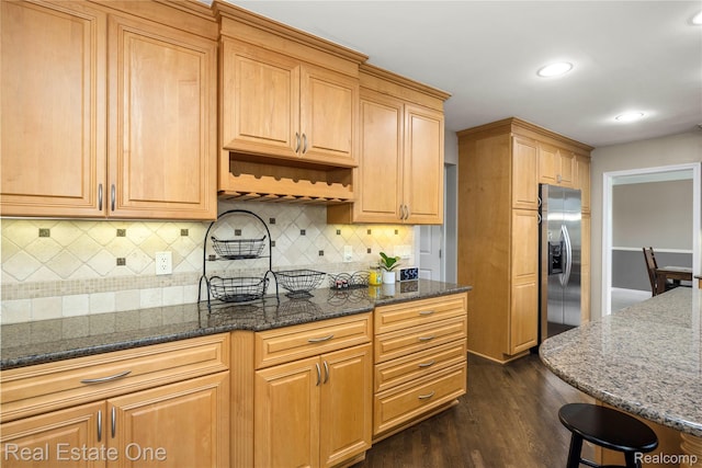25006 Davenport Ave, Novi, MI 48374 - kitchen with stainless steel fridge, dark wood finished floors, dark stone counters, tasteful backsplash, and recessed lighting
