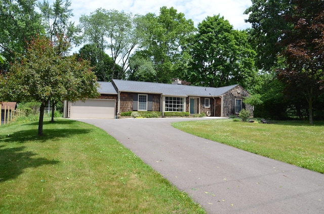 11279 E Cd Ave, Richland, MI 49083 - single story home with driveway, a garage, a chimney, and a front lawn