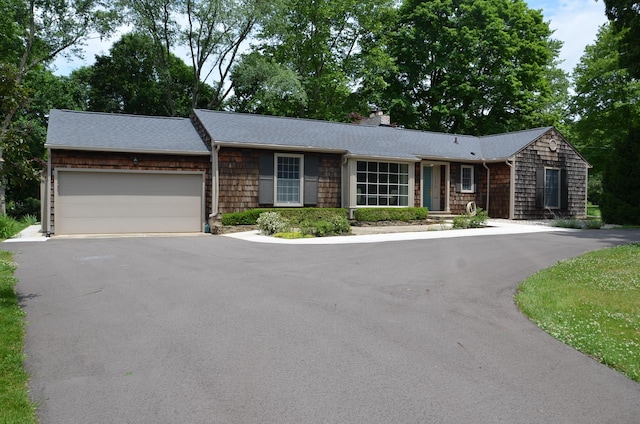 11279 E Cd Ave, Richland, MI 49083 - ranch-style home featuring a chimney, a garage, driveway, and a shingled roof