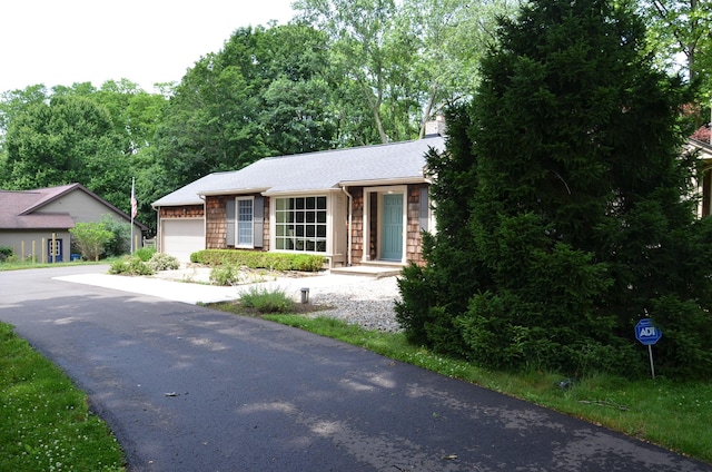 11279 E Cd Ave, Richland, MI 49083 - view of front of property with an attached garage, driveway, and roof with shingles