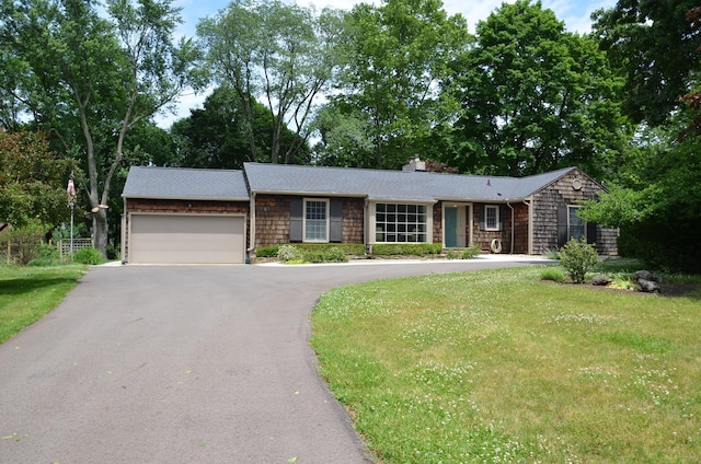 11279 E Cd Ave, Richland, MI 49083 - ranch-style home with driveway, an attached garage, a chimney, and a front lawn