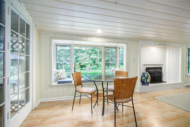 11279 E Cd Ave, Richland, MI 49083 - dining room with a glass covered fireplace, wood finished floors, and wood ceiling