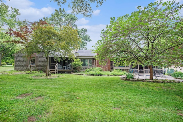 11279 E Cd Ave, Richland, MI 49083 - view of green lawn with a patio area and a sunroom