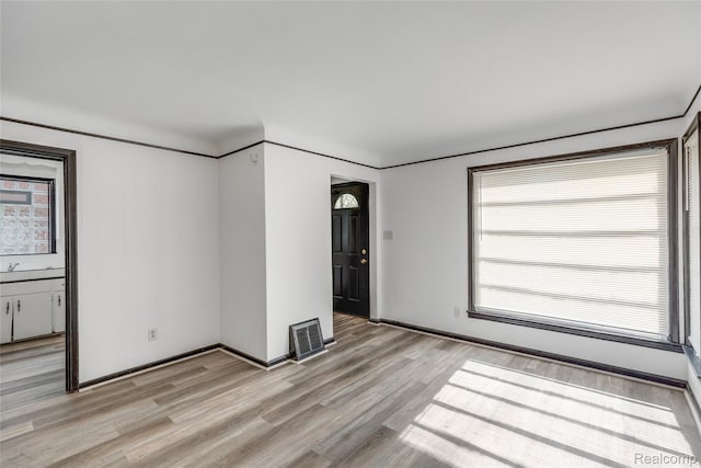 9938 Bramell, Redford, MI 48239 - spare room with light wood-style flooring and baseboards