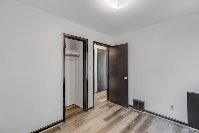 9938 Bramell, Redford, MI 48239 - unfurnished bedroom with light wood-style flooring and a closet