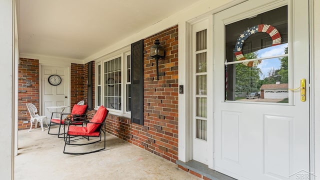 4561 Ashland Dr, Saginaw, MI 48638 - doorway to property featuring a porch and brick siding