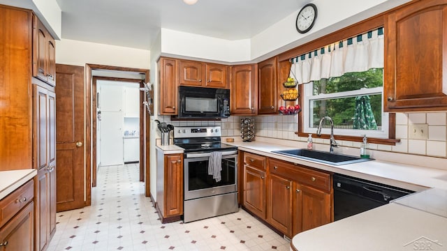 4561 Ashland Dr, Saginaw, MI 48638 - kitchen with black appliances, light flooring, light countertops, and decorative backsplash