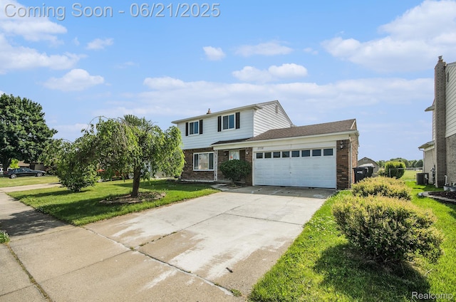 37718 Douglas Ct, Sterling Heights, MI 48310 - traditional home with brick siding, an attached garage, a front lawn, and concrete driveway