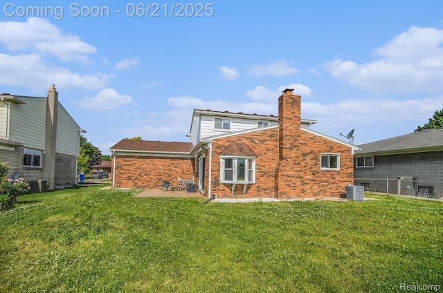 37718 Douglas Ct, Sterling Heights, MI 48310 - back of house featuring brick siding, a lawn, a patio, and a chimney